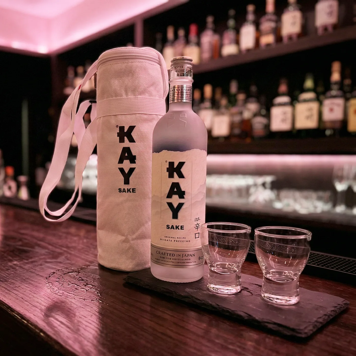 Kay Sake sharing bottle